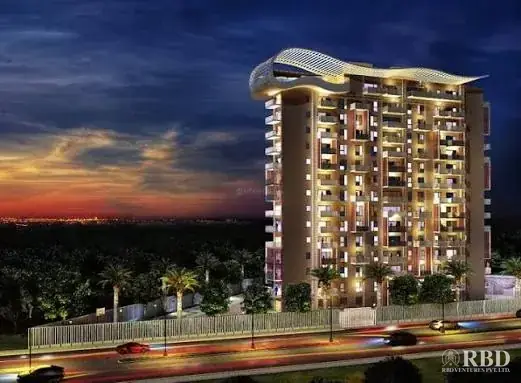 Premia high-rise in Jakkur, North Bengaluru, lit up at dusk with its signature curved rooftop canopy